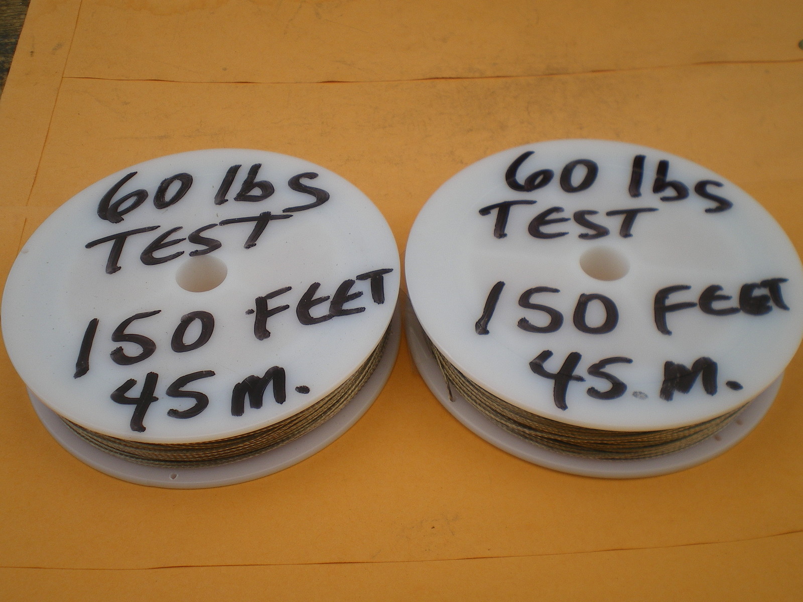 STAINLESS STEEL WIRE LEADER 300 FEET (90m.) 60 lbs. TEST 1X7 STRAND-COATED-CLEAR