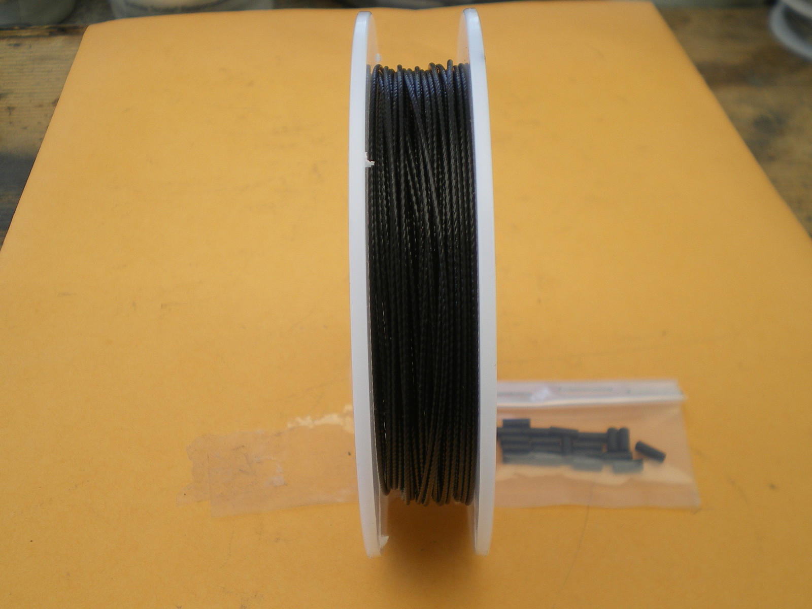 STAINLESS STEEL BLACK WIRE LEADER 300 FEET (90m.) 20 lbs. TEST 1X7 STRAND COATED